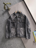 Distressed black denim jacket with button front and chest flap pockets