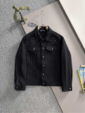 Black button-front denim jacket with floral embroidery on chest pockets