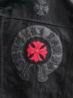 Back circular patch on black denim with red flower and embossed lettering