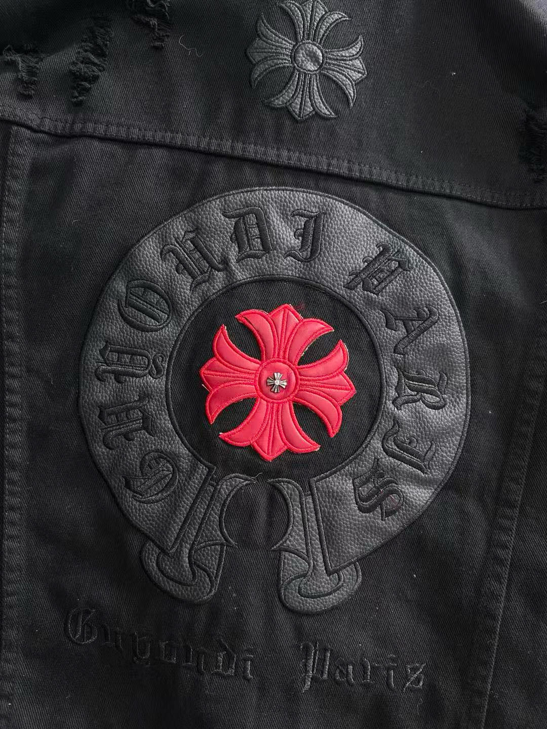 Back circular patch on black denim with red flower and embossed lettering
