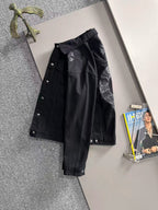 Black long-sleeve denim jacket with large front and sleeve embroidery details