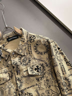 Long-sleeve button-up shirt close-up of collar and ornate fabric pattern on beige