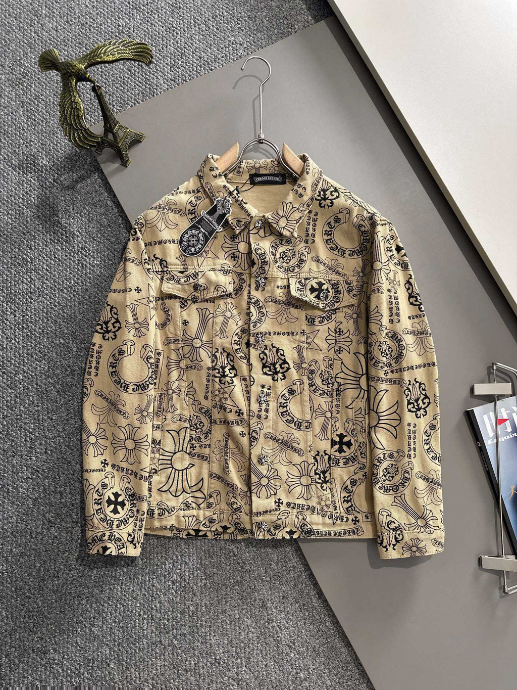 Long-sleeve button-up shirt with ornate black and dark-blue print on beige