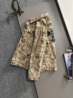 Long-sleeve button-up shirt with ornate print and chest pocket, beige