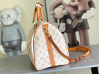 Monogram hobo bag with tan leather strap and logo pattern, top handle loop