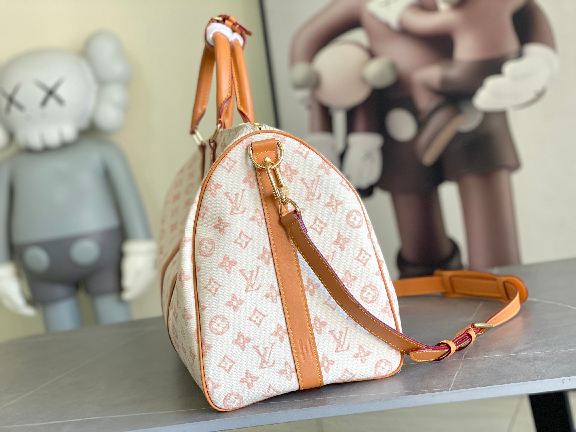 Monogram hobo bag with tan leather strap and logo pattern, top handle loop