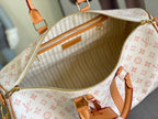 Open monogram tote interior with tan lining, zipper pocket, and top handles