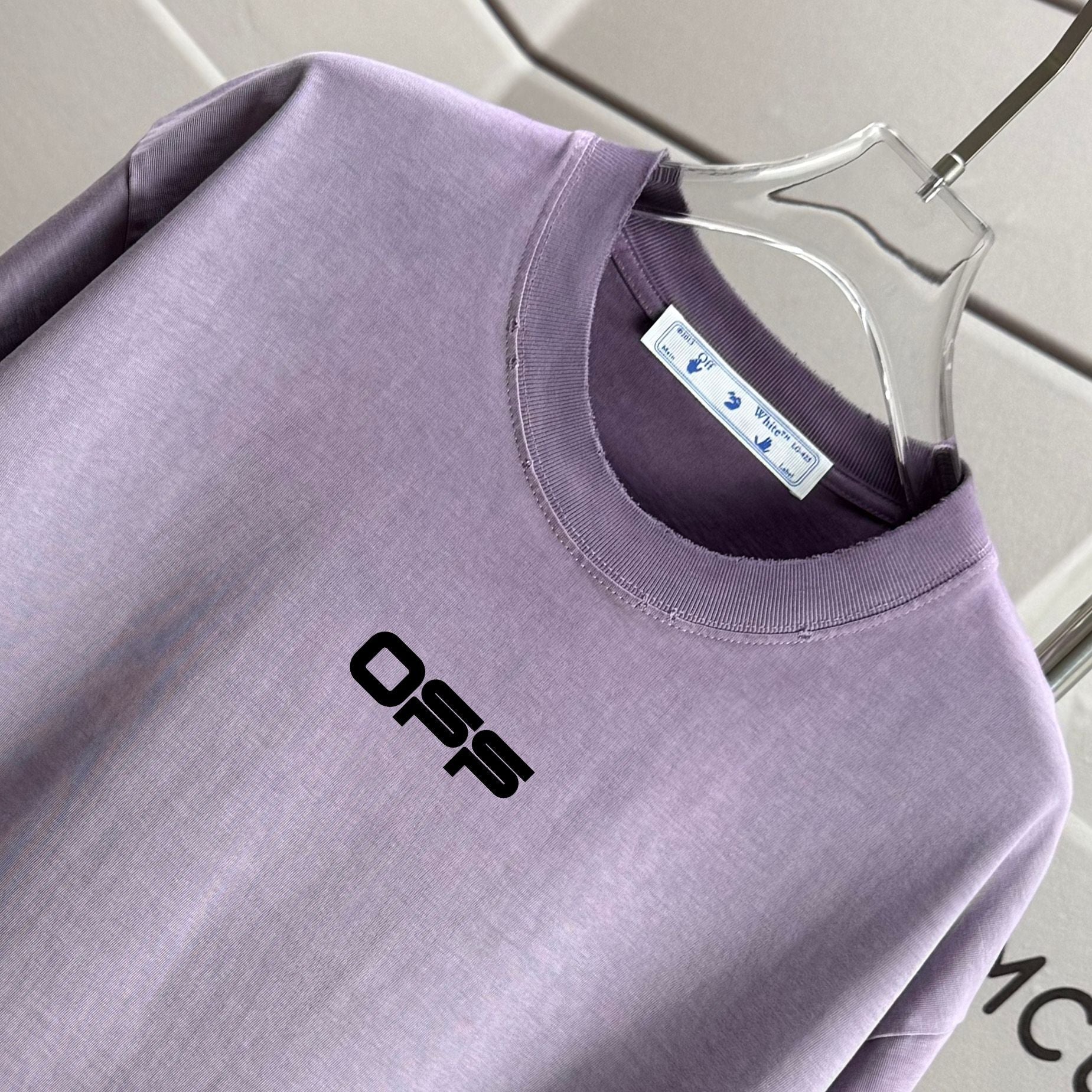 Lavender T-shirt with ribbed crew neck and small chest logo