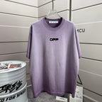 Lavender T-shirt with small front logo text at chest