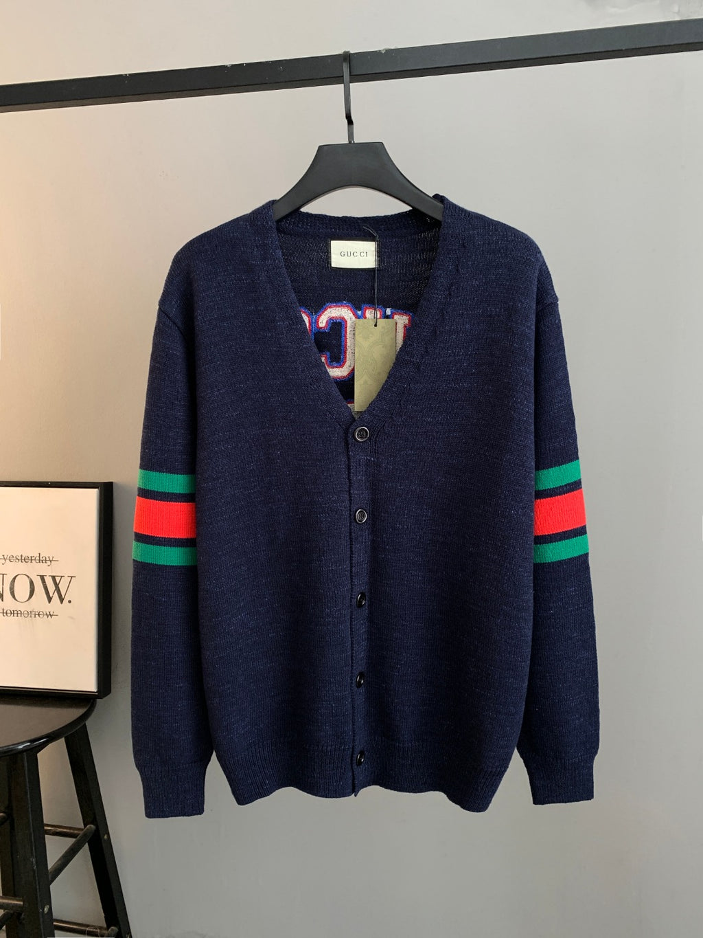 Navy knit cardigan with button front and multicolor stripe sleeves