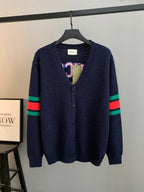 Navy knit cardigan with button front and multicolor stripe sleeves