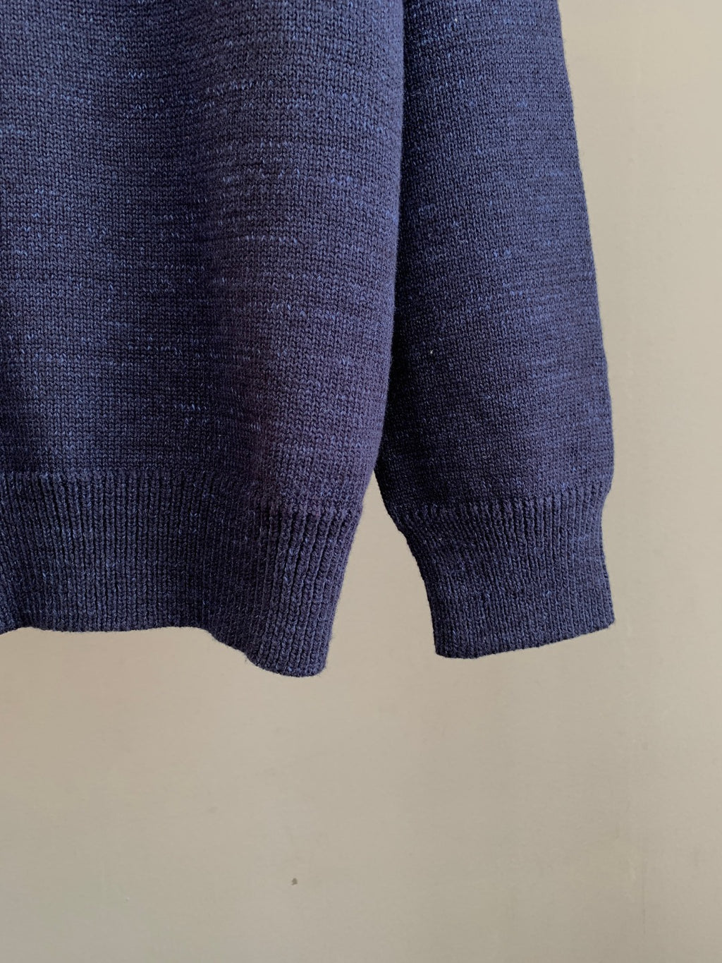 Navy knit cardigan ribbed hem and knit texture at bottom