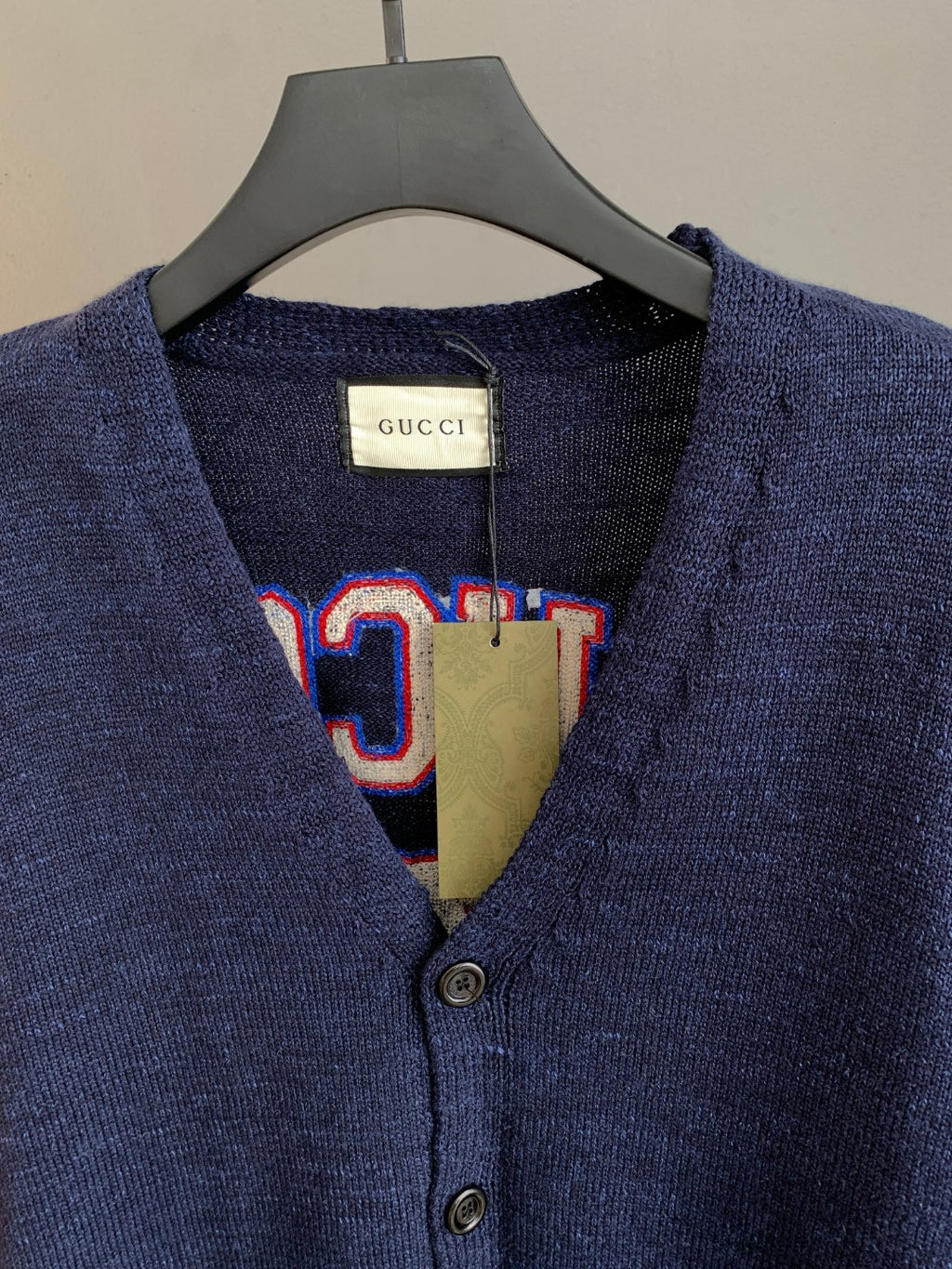 Navy knit cardigan neckline with button placket and Gucci interior label