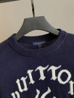 Navy crewneck sweater close-up with ribbed collar and white graphic logo
