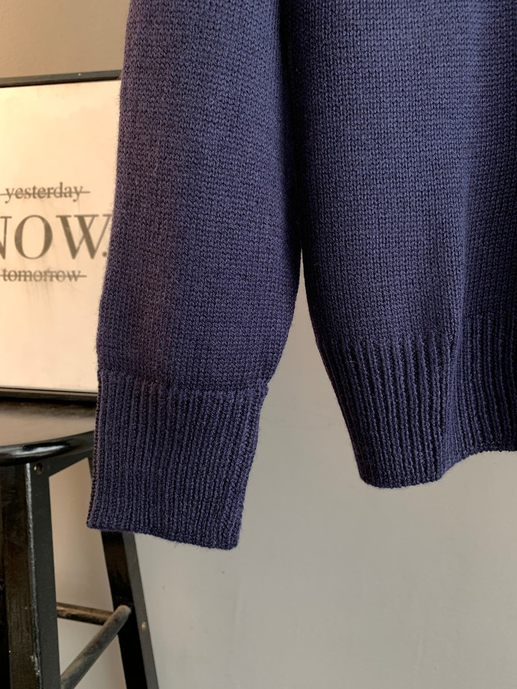 Navy knit sweater hem and sleeves, ribbed cuffs and knit texture