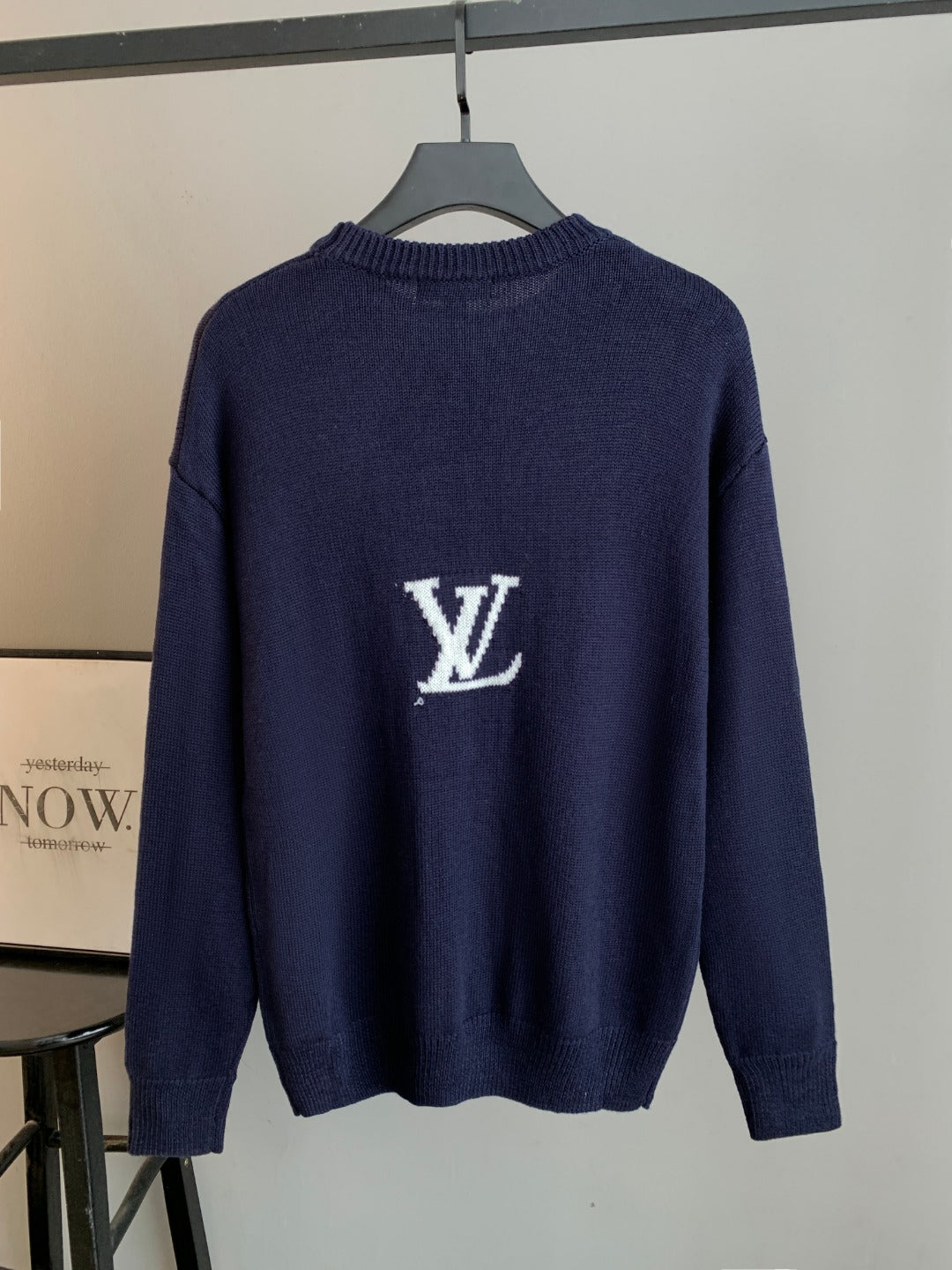 Navy knit long-sleeve sweater with small white Louis Vuitton LV emblem on back