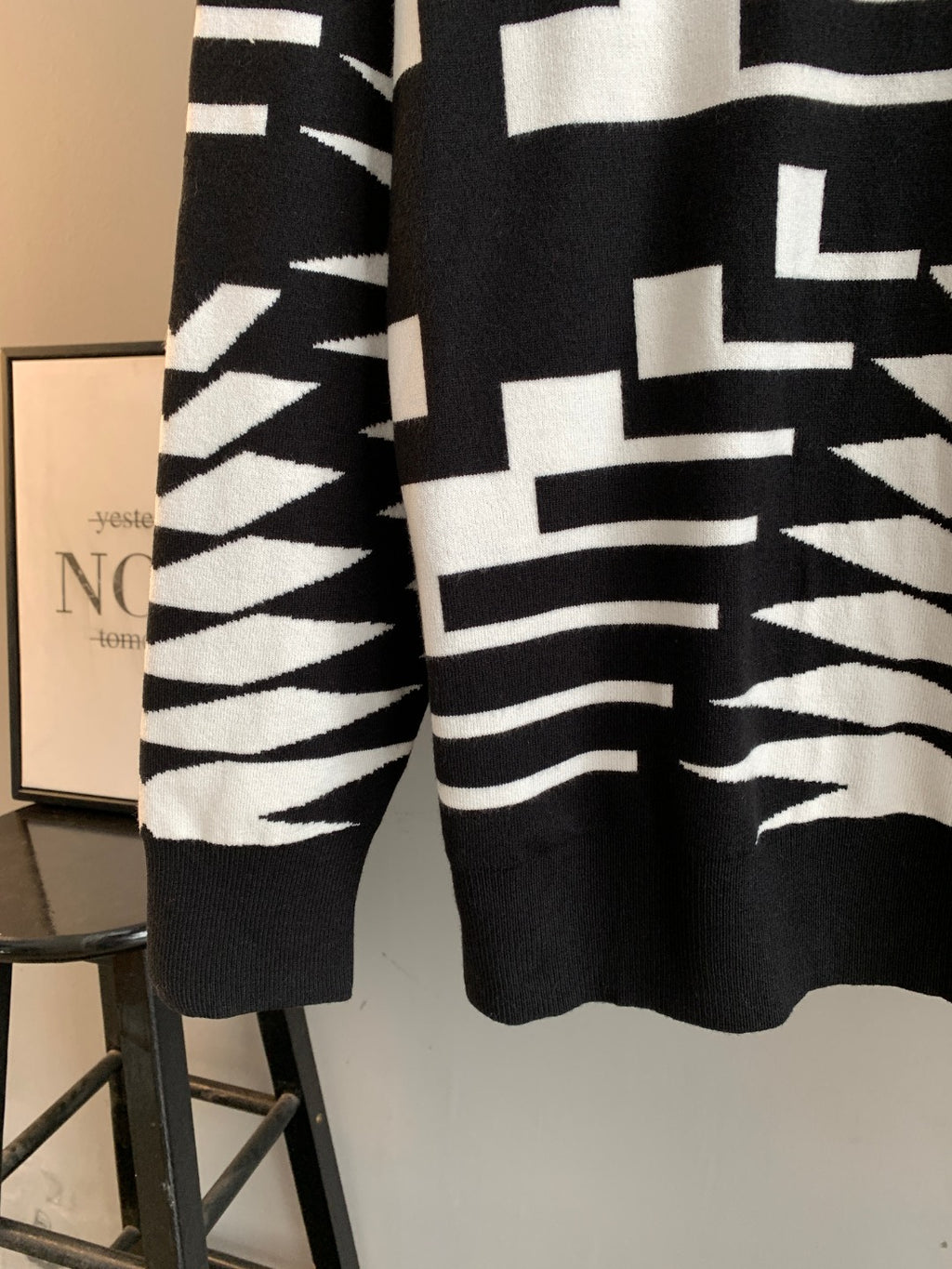 Knit sweater front with bold black-and-white geometric knit design