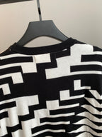 Knit sweater collar and upper chest with black-and-white geometric design