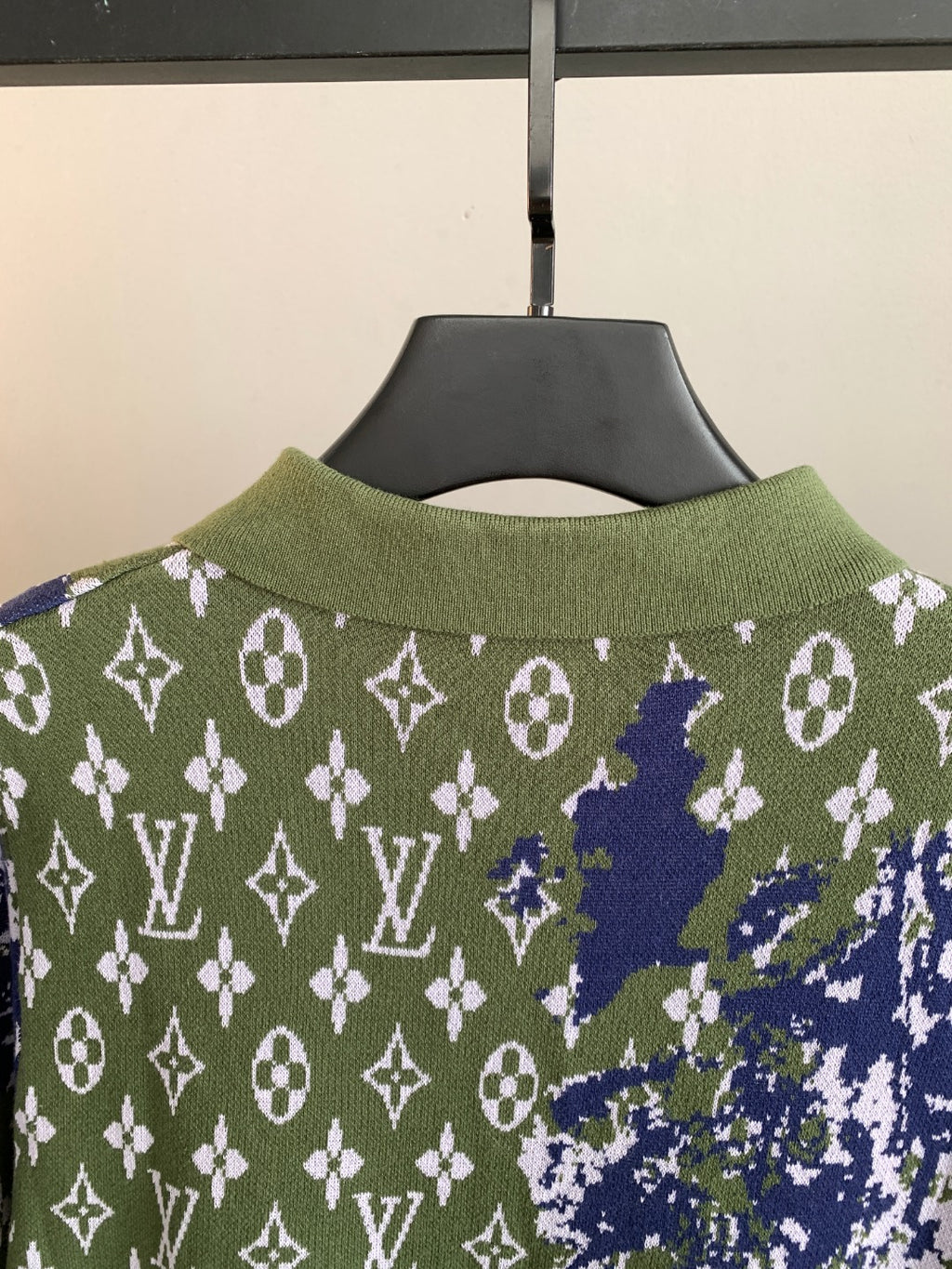 Louis Vuitton sweater back neckline close-up in green with blue and white monogram pattern