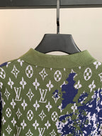 Louis Vuitton sweater back neckline close-up in green with blue and white monogram pattern