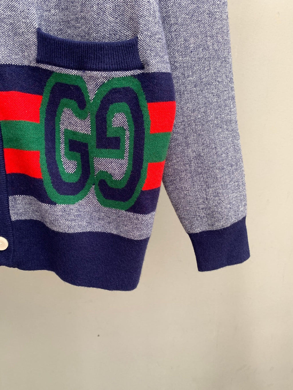 Long cardigan by Gucci with GG motif on multicolor stripe panel and navy hem