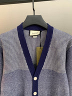 Long cardigan by Gucci with V-neck placket, striped knit shoulders, button front