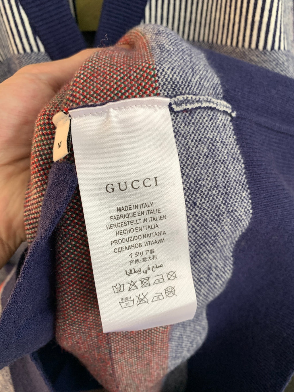 Gucci long cardigan interior care label with Made in Italy text