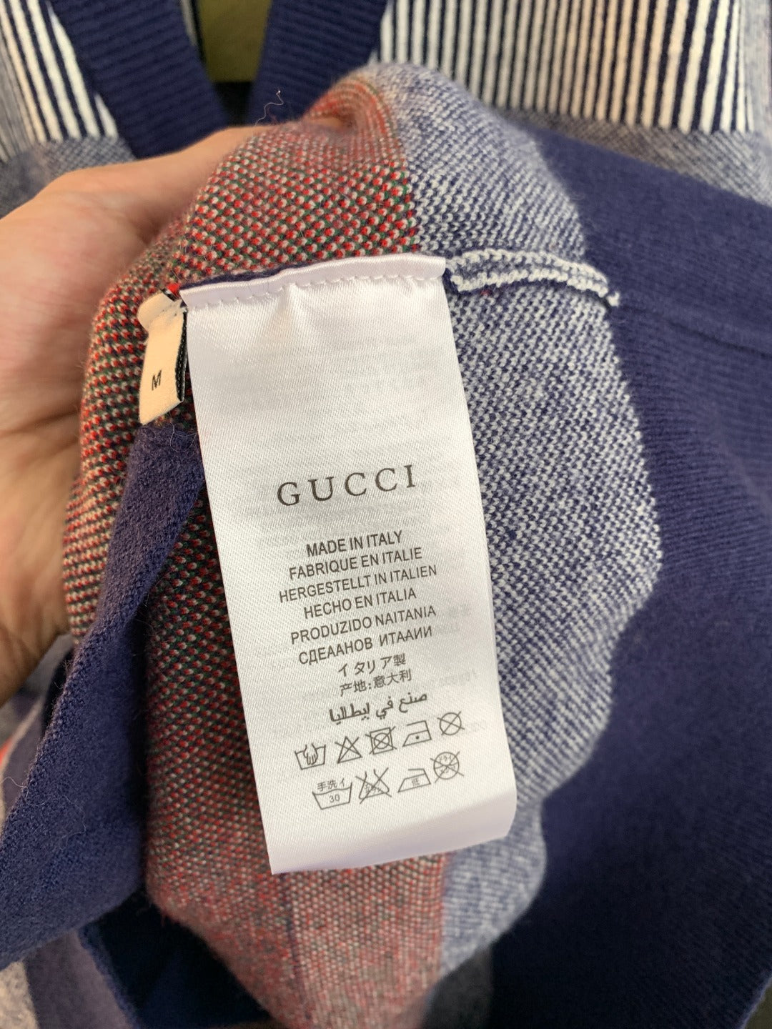 Gucci long cardigan interior care label with Made in Italy text