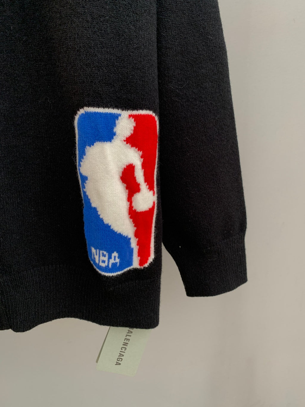 Dark knit cardigan with NBA logo patch on the chest