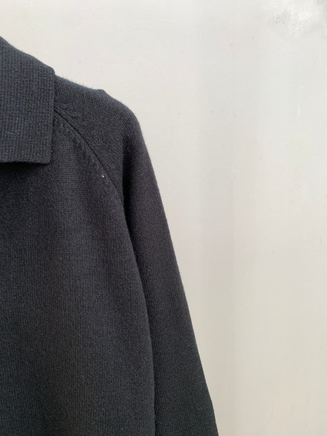 Dark knit cardigan sleeve and shoulder seam