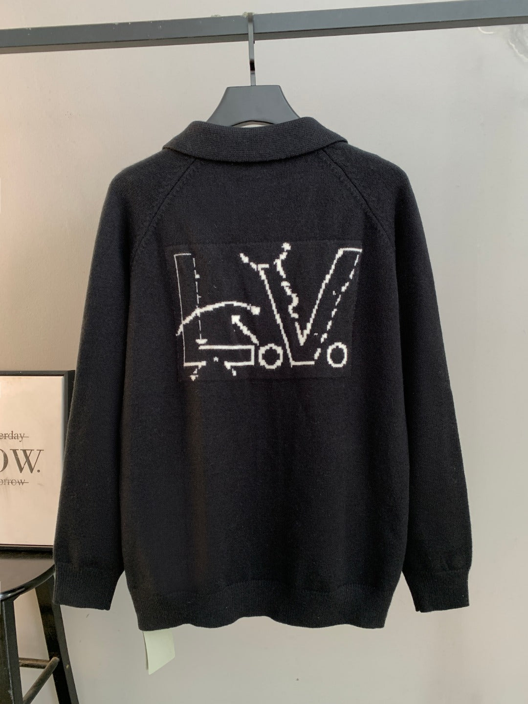 Dark knit cardigan with back graphic text and line design