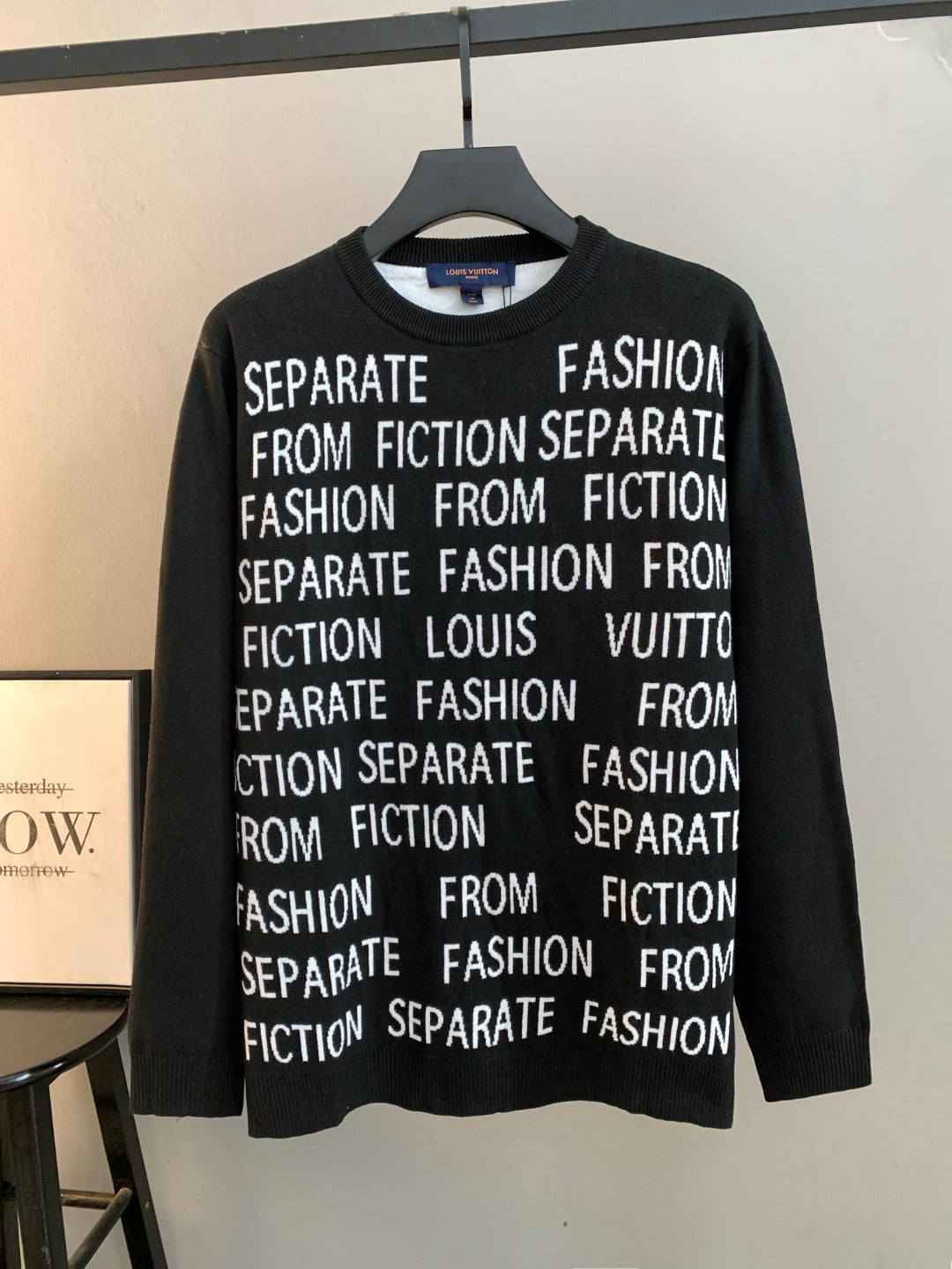 Black long-sleeve crewneck sweater with white "Fashion" and "Separate" text print