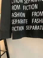 Black sweater front with repeating white "Separate" and "Fiction" text near hem