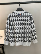 Crewneck long-sleeve sweater, light knit with repeating black silhouette pattern