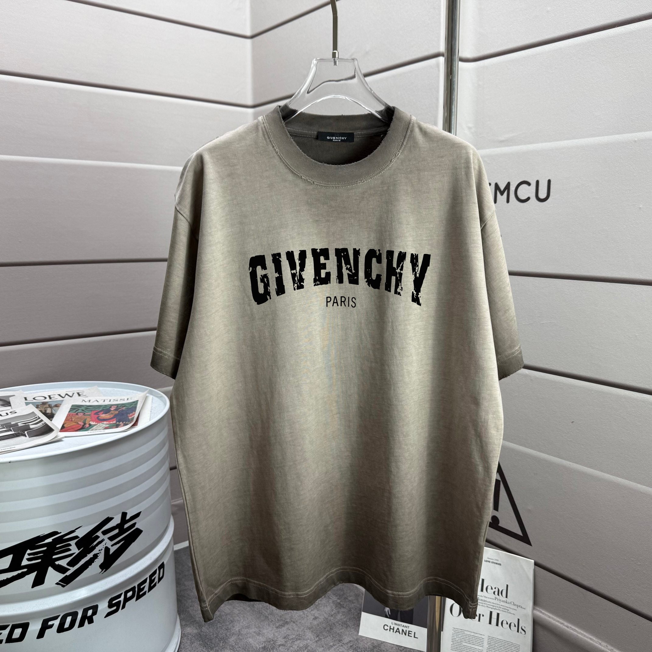 Givenchy T-shirt in sage gray with front “GIVENCHY” text and “PARIS”