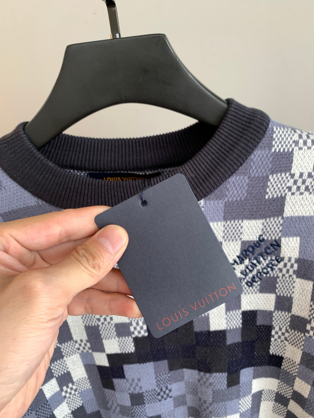 Louis Vuitton knit sweater neckline with ribbed collar and navy shoulder check pattern
