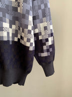 Louis Vuitton check knit sweater sleeve detail with navy cuffs and white blocks