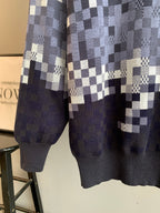 Louis Vuitton check knit sweater lower half with navy hem and long sleeves