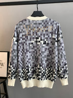 Louis Vuitton long-sleeve sweater, black-and-white check knit with cream ribbed cuffs