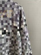Louis Vuitton sweater side view in black-and-white check knit, long sleeves