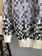 Louis Vuitton long-sleeve sweater hem in black-and-white check knit with cream ribbing