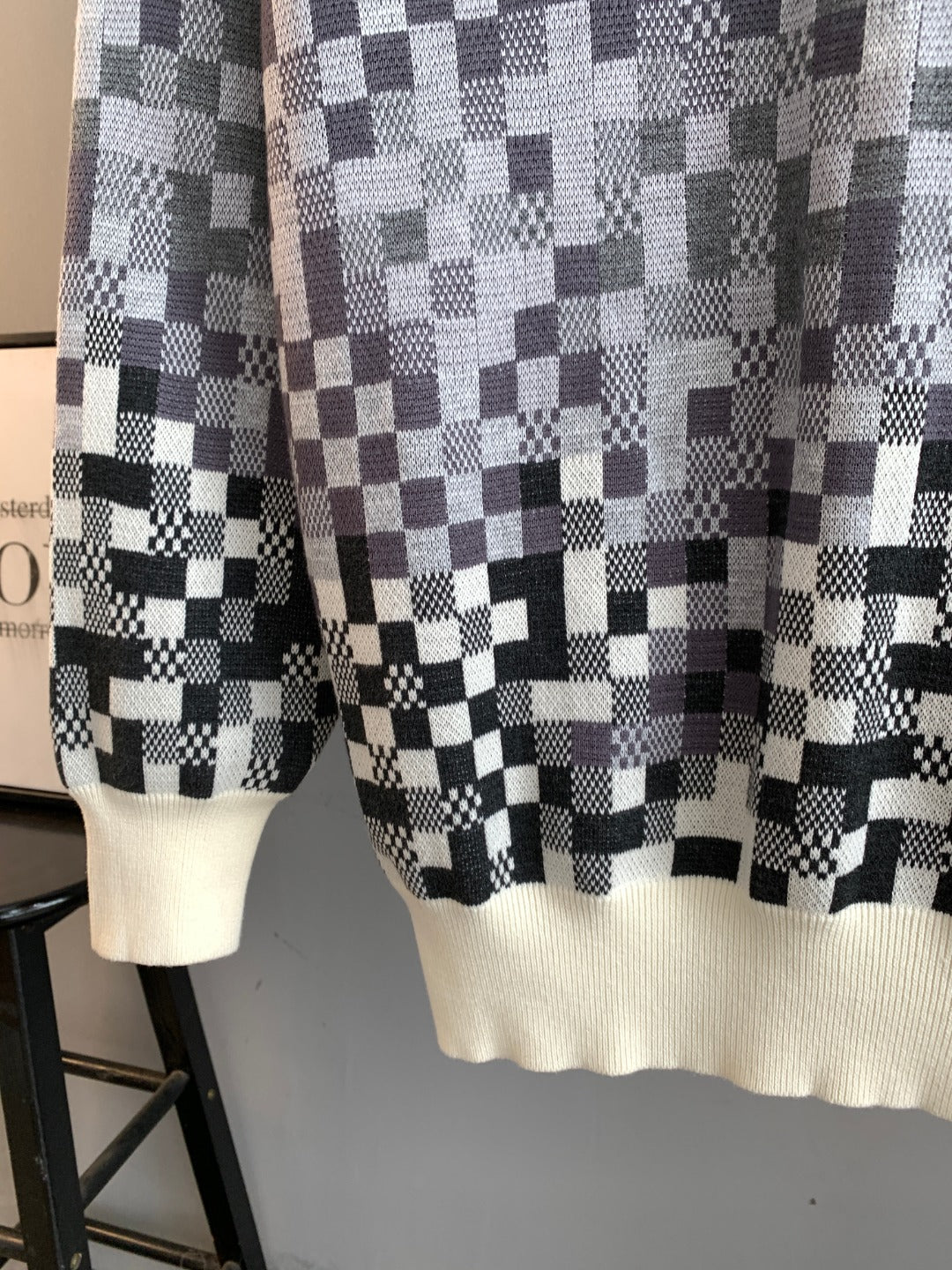 Louis Vuitton long-sleeve sweater hem in black-and-white check knit with cream ribbing