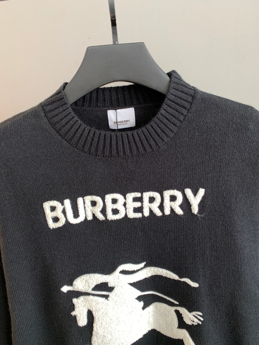 Burberry sweater chest detail with ribbed crew neck and white BURBERRY logo