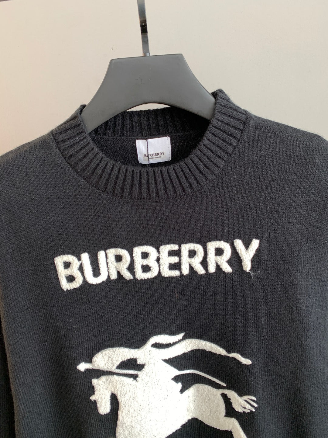 Burberry sweater chest detail with ribbed crew neck and white BURBERRY logo