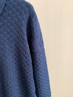 Blue textured knit sweater sleeve and side panel