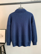 Blue knit sweater with ribbed turtleneck collar and long sleeves, back view