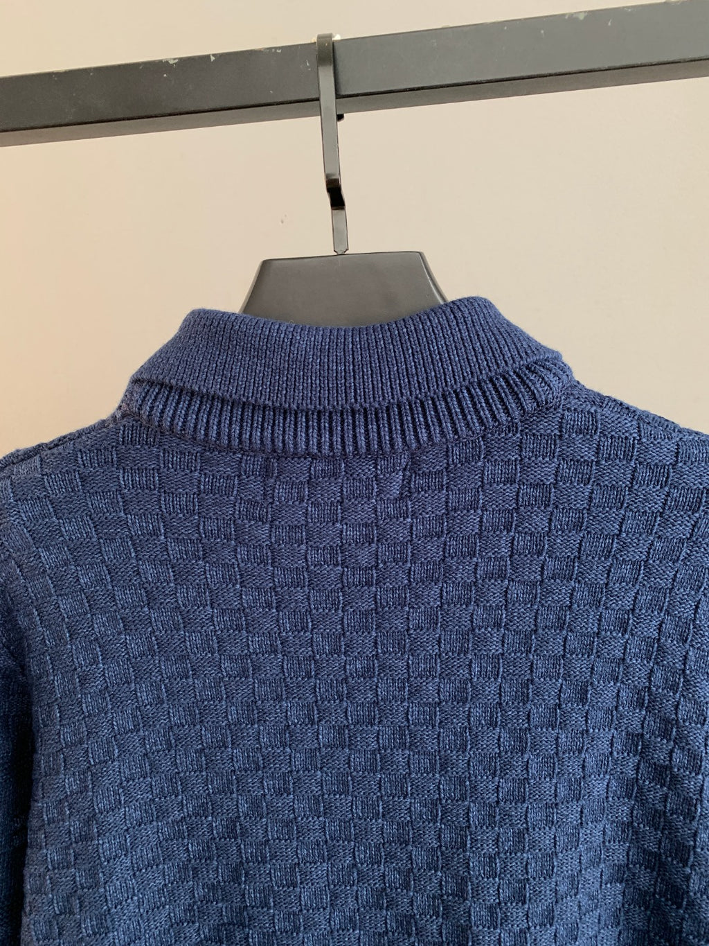 Blue knit sweater close-up of ribbed turtleneck and textured back