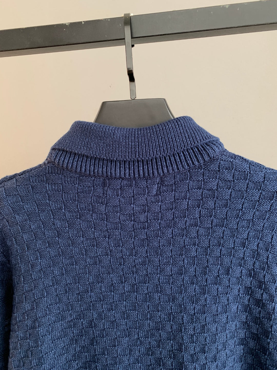 Blue knit sweater close-up of ribbed turtleneck and textured back