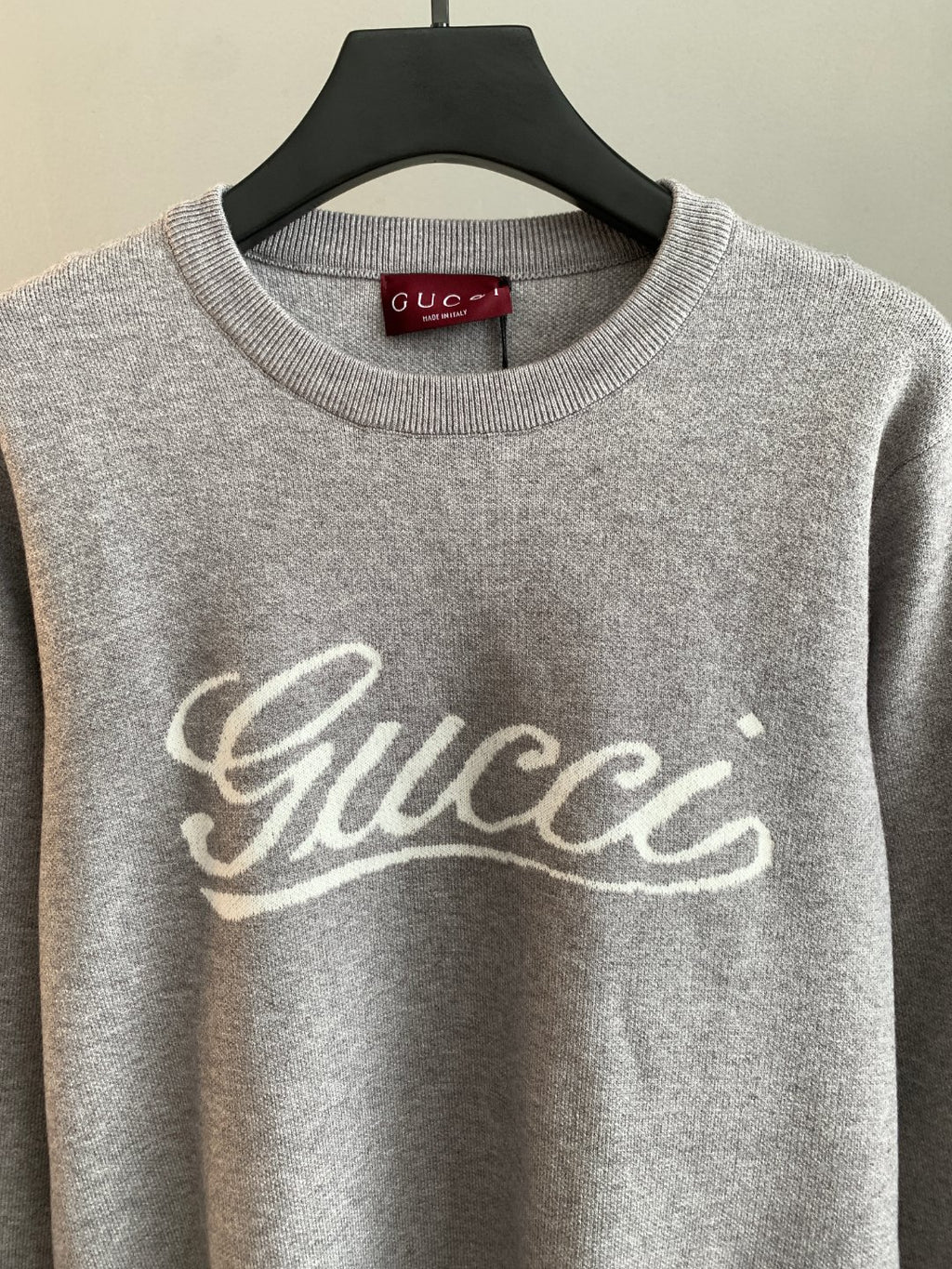 Grey sweatshirt with Gucci script logo on chest