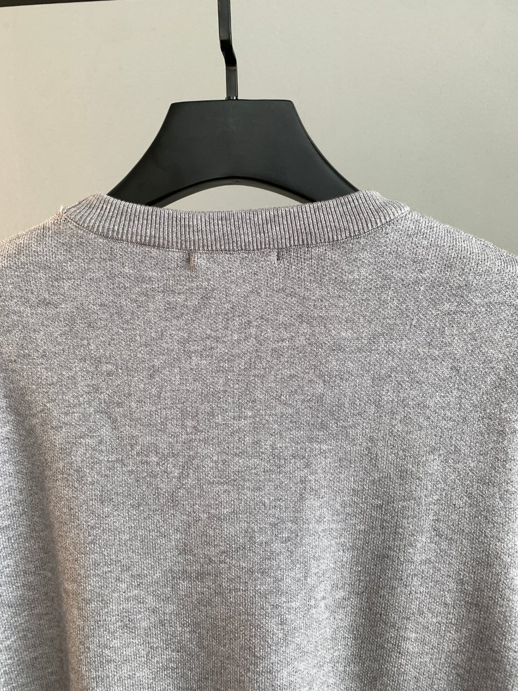 Grey sweatshirt back neckline with small center seam
